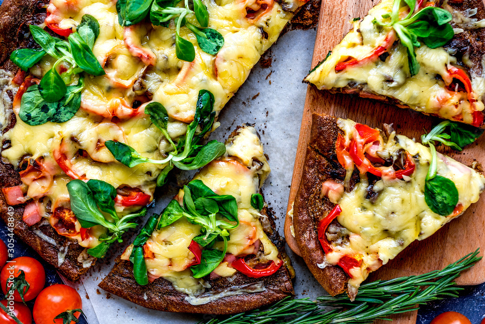 restaurant kitchen with pizza preparing on stone background top view