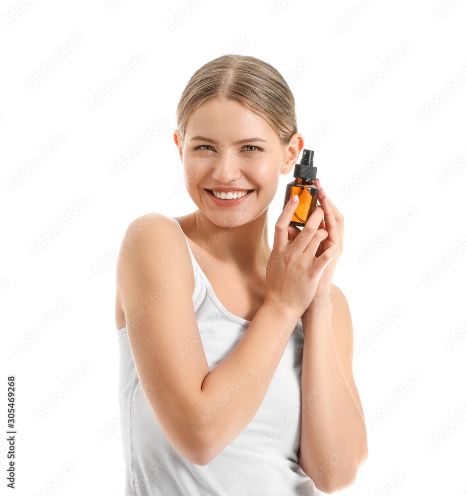 Beautiful young woman with cosmetic product on white background