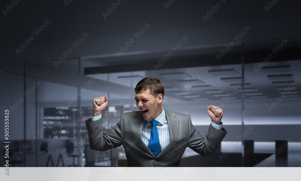 Happy excited businessman celebrating victory