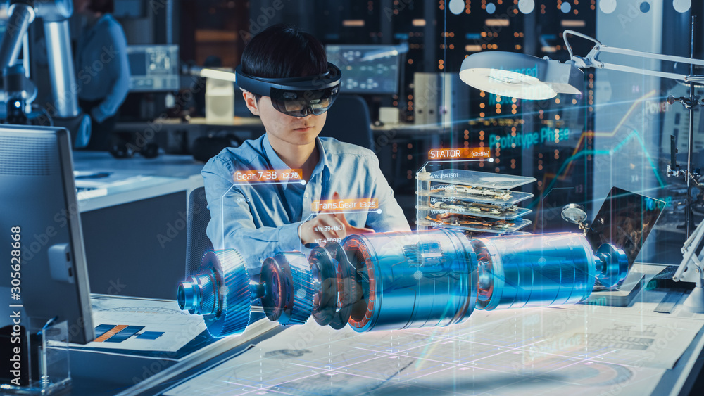 Industrial Factory Chief Engineer Wearing AR Headset Designs a Prototype of an Electric Motor on the