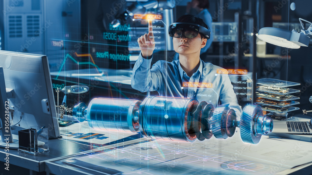 Industrial Factory Chief Engineer Wearing AR Headset Designs a Prototype of an Electric Motor on the