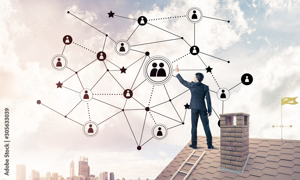 Businessman on house roof presenting networking and connection c