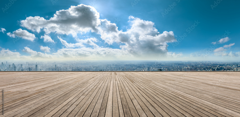 Wooden square and city skyline with buildings in Shanghai,China.