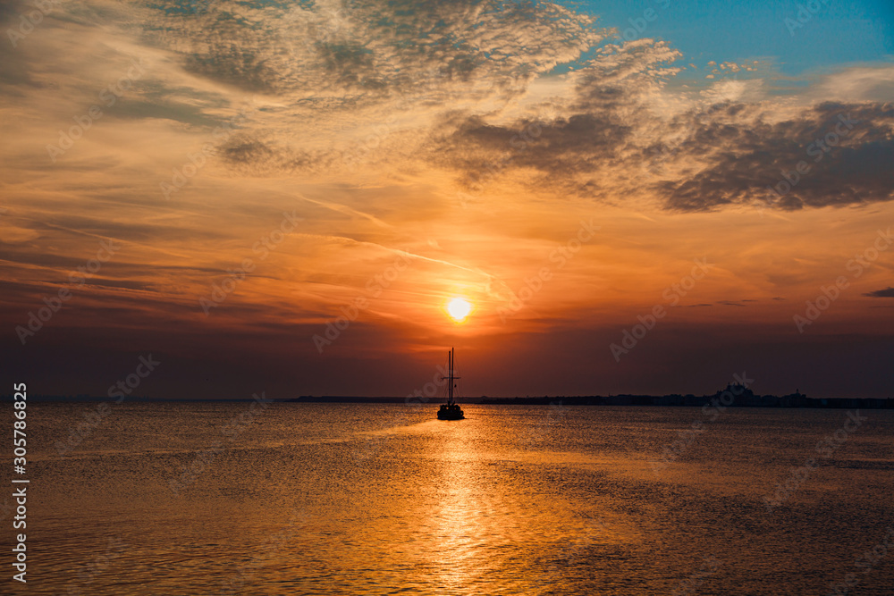 boat in the sea, sunset