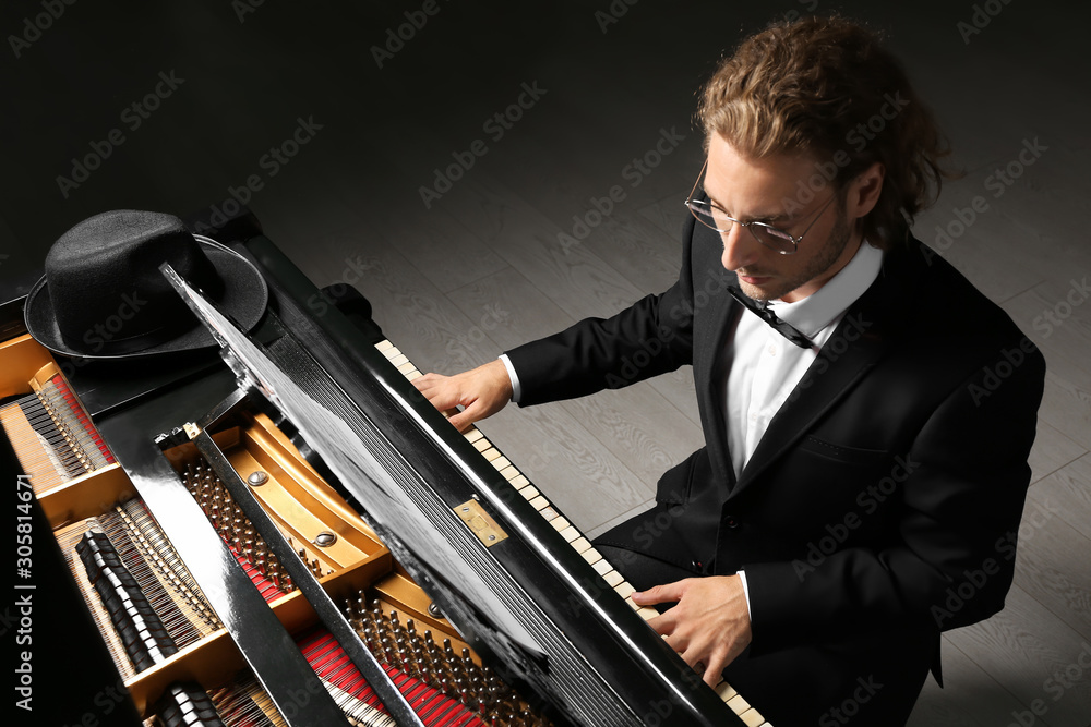 Man playing grand piano at the concert