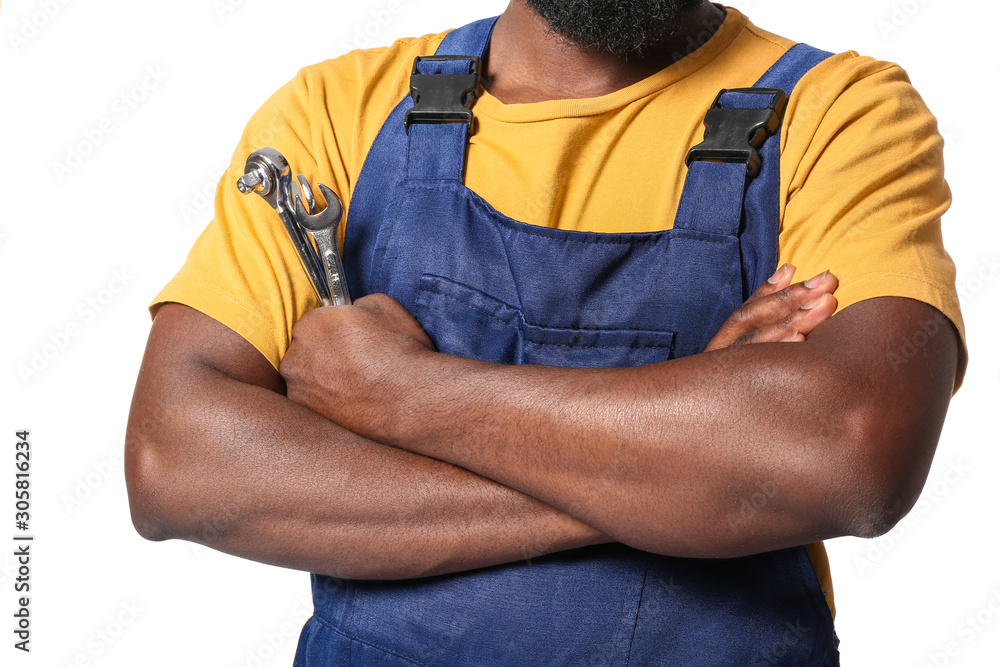 African-American car mechanic on white background, closeup