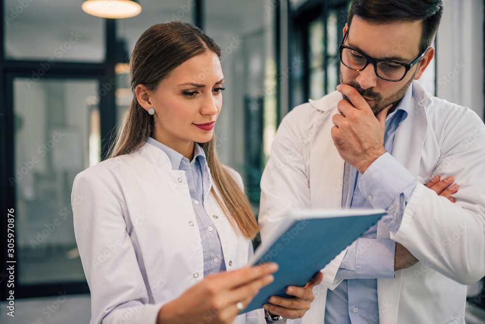 Two doctors discussing a medical case, close-up, portrait.