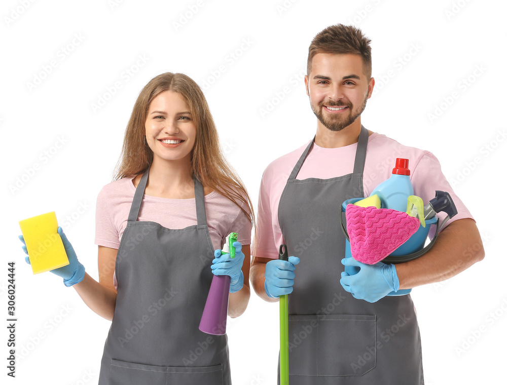 Team of janitors with cleaning supplies on white background