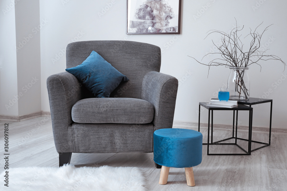 Comfortable armchair in interior of living room