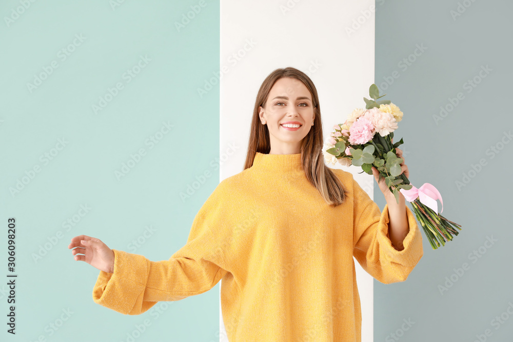 Beautiful young woman with bouquet of carnation flowers on color background