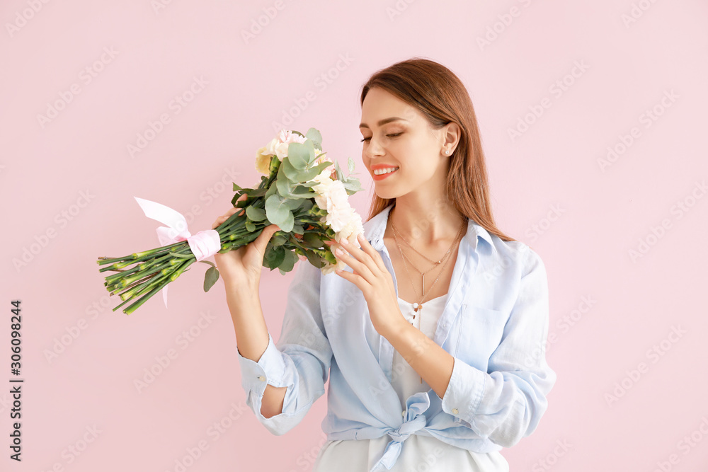 Beautiful young woman with bouquet of carnation flowers on color background