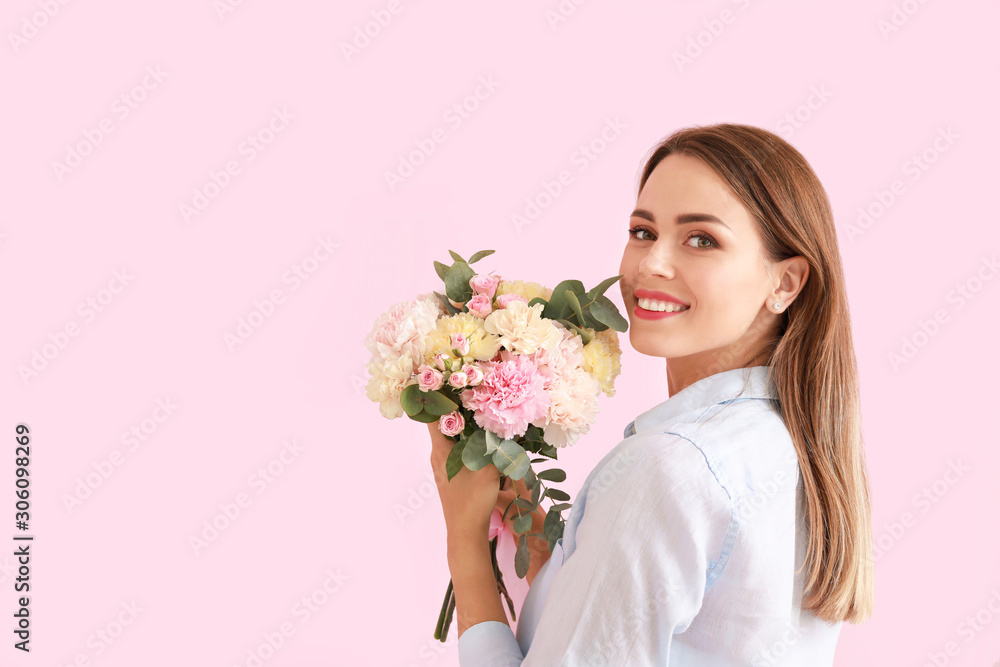 Beautiful young woman with bouquet of carnation flowers on color background