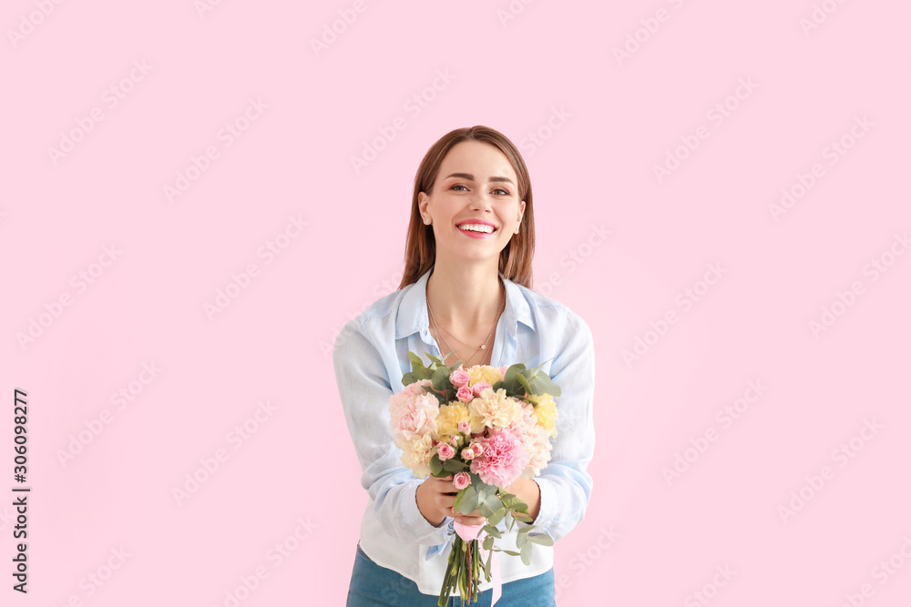 Beautiful young woman with bouquet of carnation flowers on color background