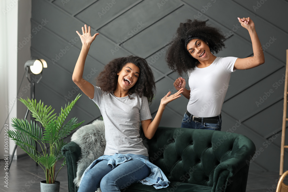 Young African-American women having fun at home