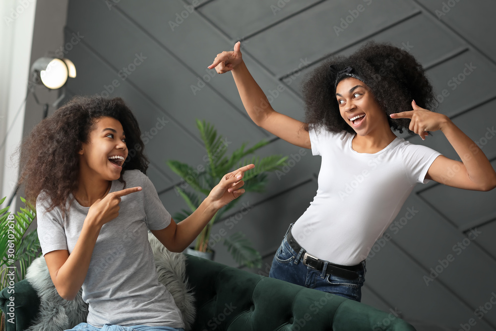 Young African-American women having fun at home