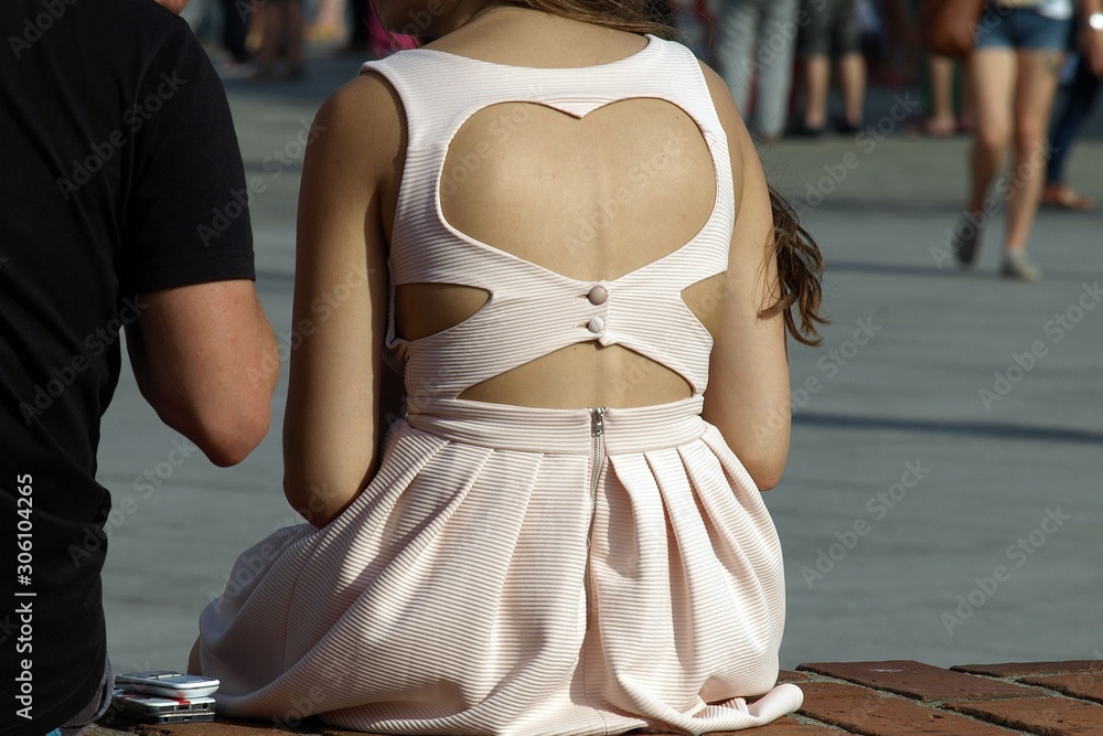 A woman sitting backwards