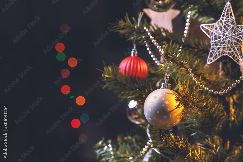 Beautiful Christmas decor concept, bauble hanging on the Christmas tree with sparkling light spot, b