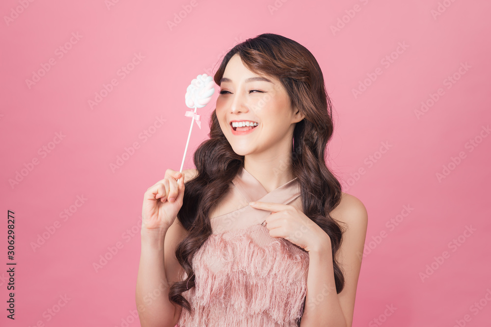 young asian woman with lolipop