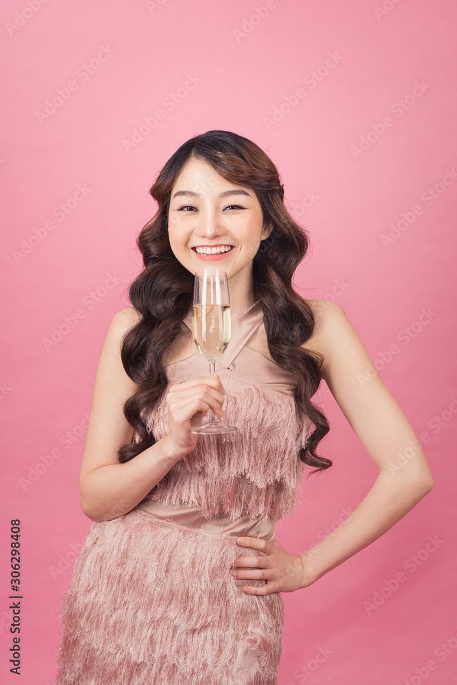 Portrait of a beautiful asian woman with glass of champagne.