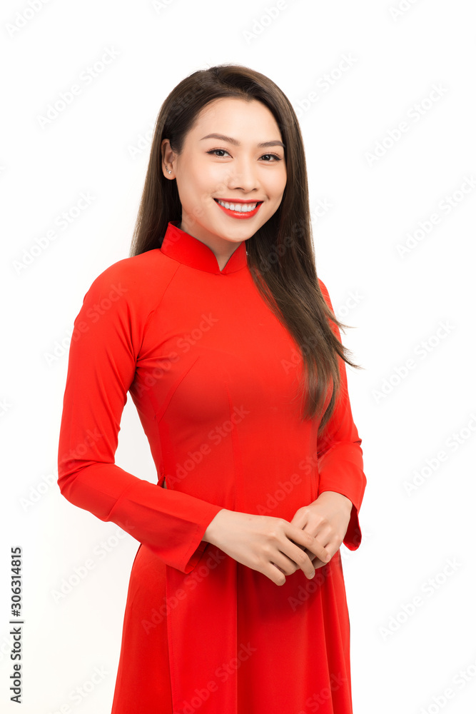 Happy lunar new year. Asian girl in vietnamese traditional dress (ao dai) on white background