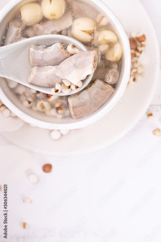 Tasty Four Tonics Herb Flavor Soup, Taiwanese traditional food with herbs, pork intestines on white 