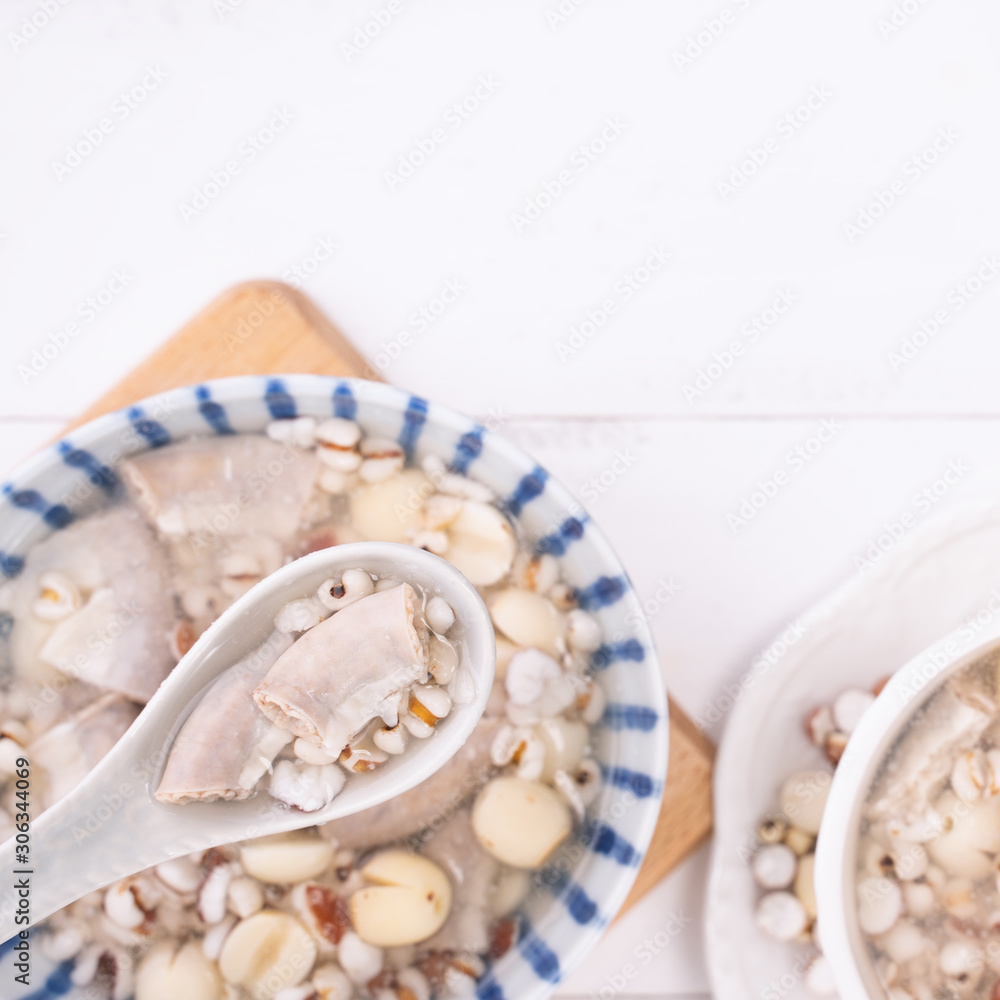 Tasty Four Tonics Herb Flavor Soup, Taiwanese traditional food with herbs, pork intestines on white 