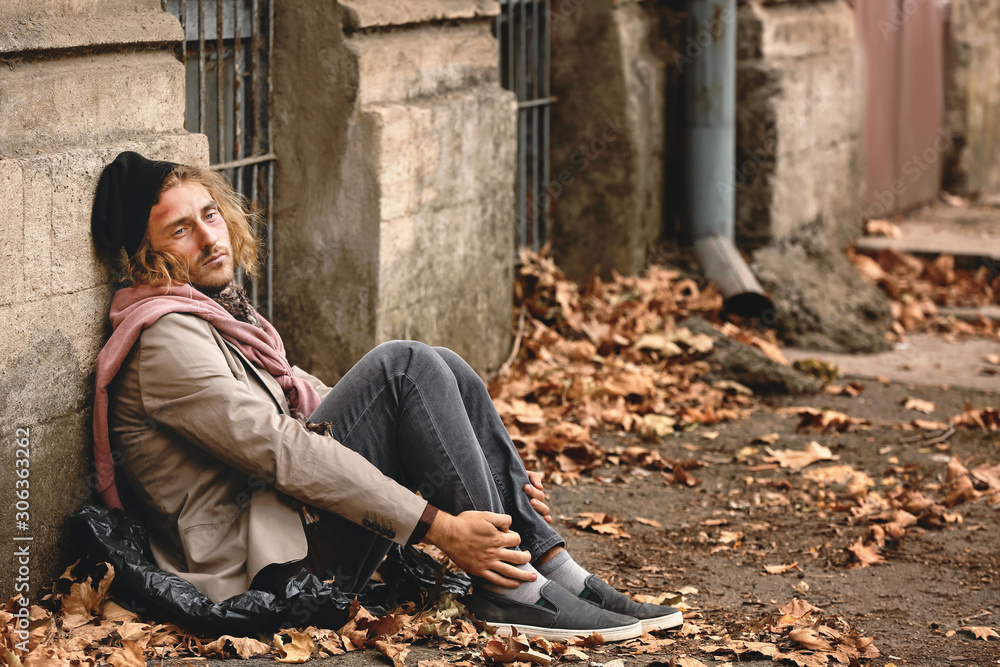 Portrait of poor homeless man outdoors