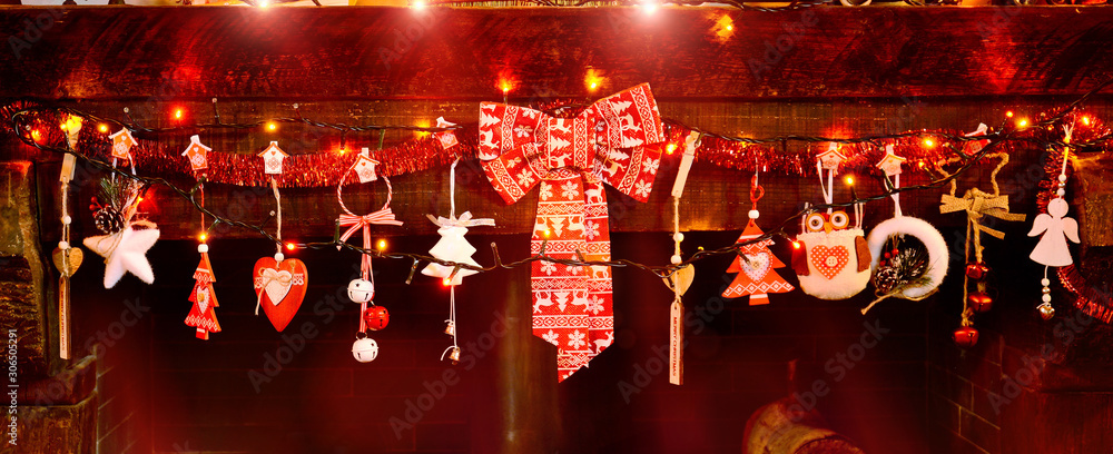 christmas decoration on the fireplace with colored lights