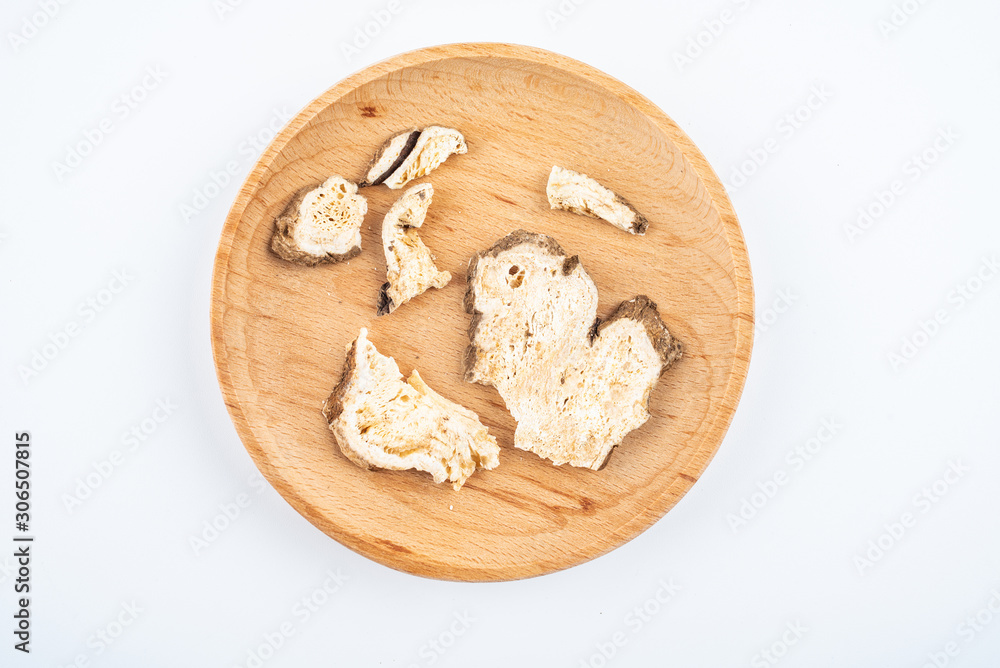 Chinese traditional medicinal herbs atractylodes tablets on white background