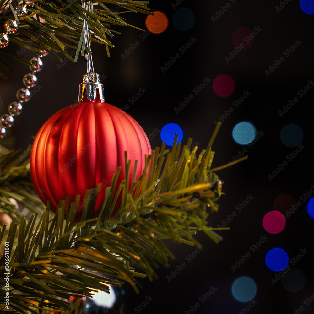 Beautiful Christmas decor concept, bauble hanging on the Christmas tree with sparkling light spot, b