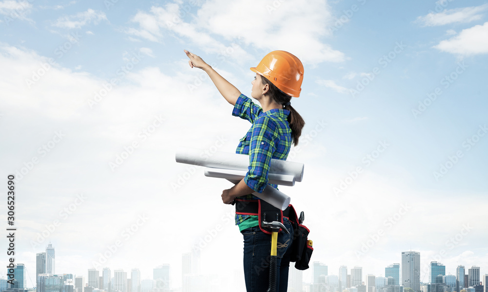 Woman architect in checkered blue shirt