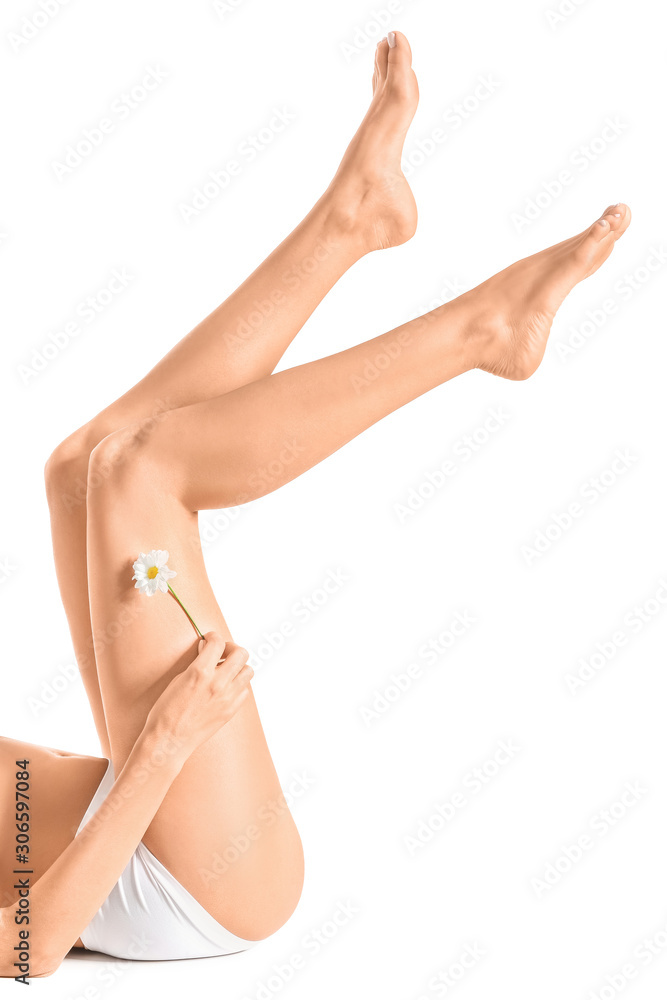 Woman with beautiful legs after depilation on white background