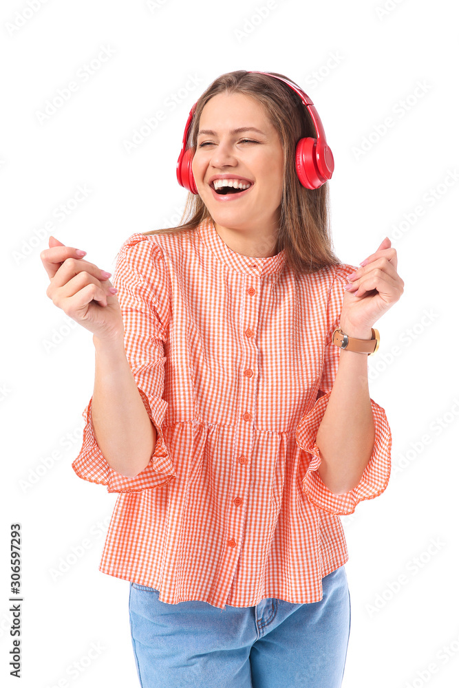 Beautiful young woman listening to music on white background