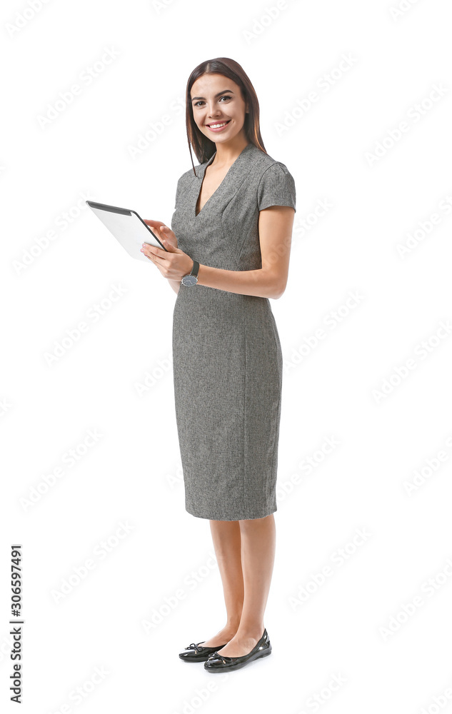 Beautiful young businesswoman with tablet computer on white background