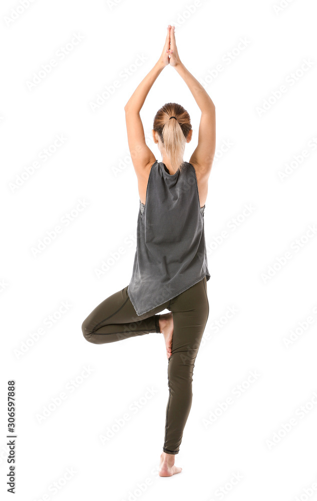 Beautiful young woman practicing yoga on white background