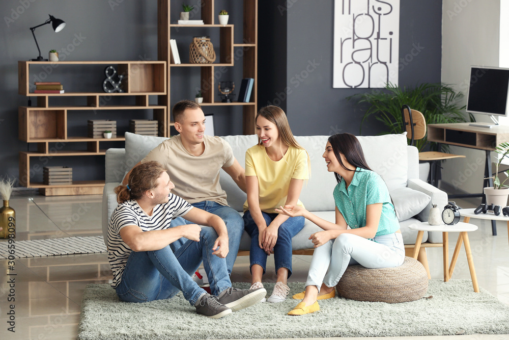 Group of friends resting together at home