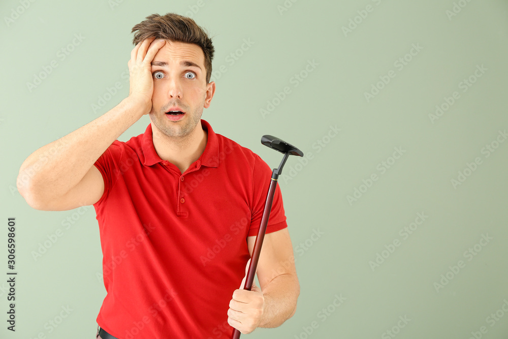 Shocked male golfer on color background