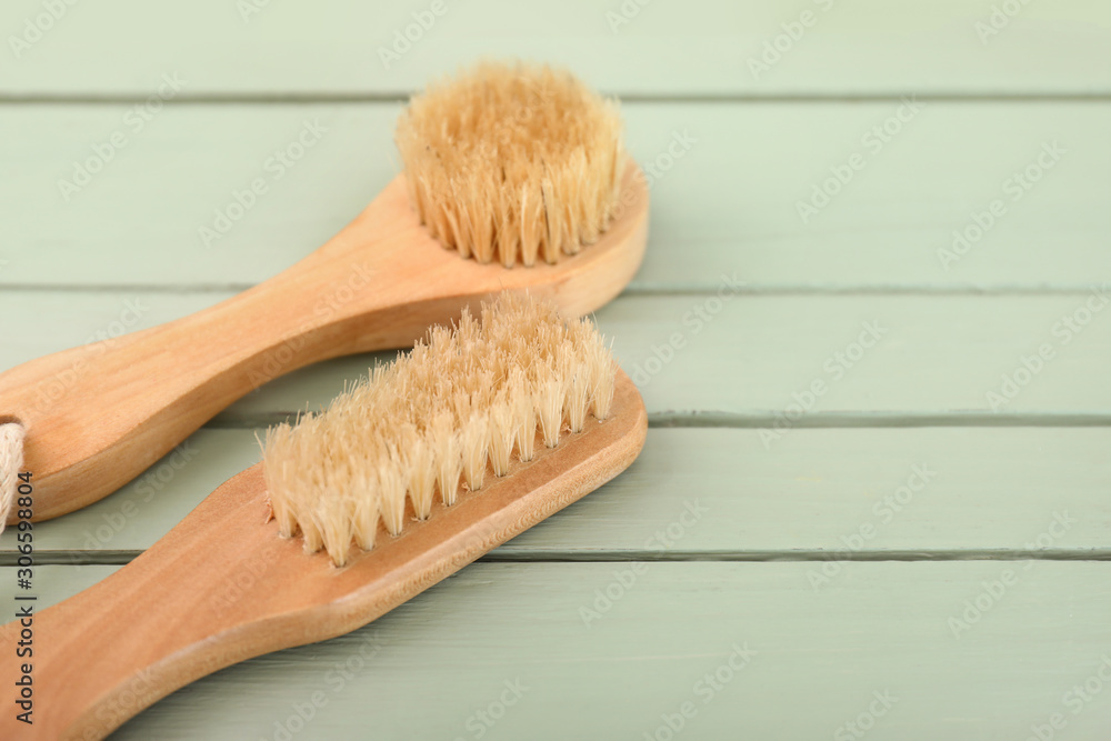 Brushes for bath on wooden background