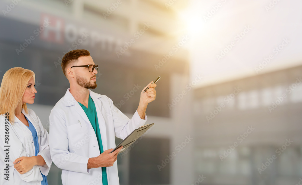 Doctor working with another doctor in the hospital. Healthcare and medical service.