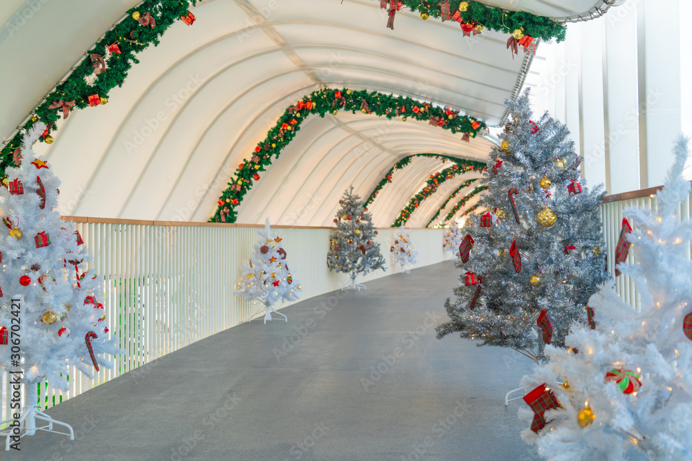 Christmas tree decoration along walkway in city center in Christmas festival of December 2019.