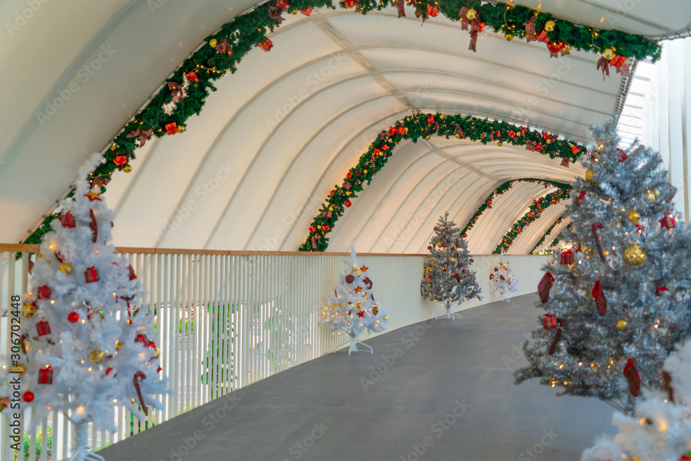 Christmas tree decoration along walkway in city center in Christmas festival of December 2019.