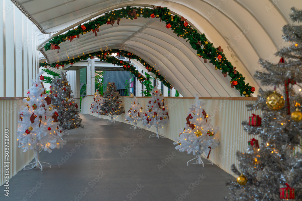 Christmas tree decoration along walkway in city center in Christmas festival of December 2019.