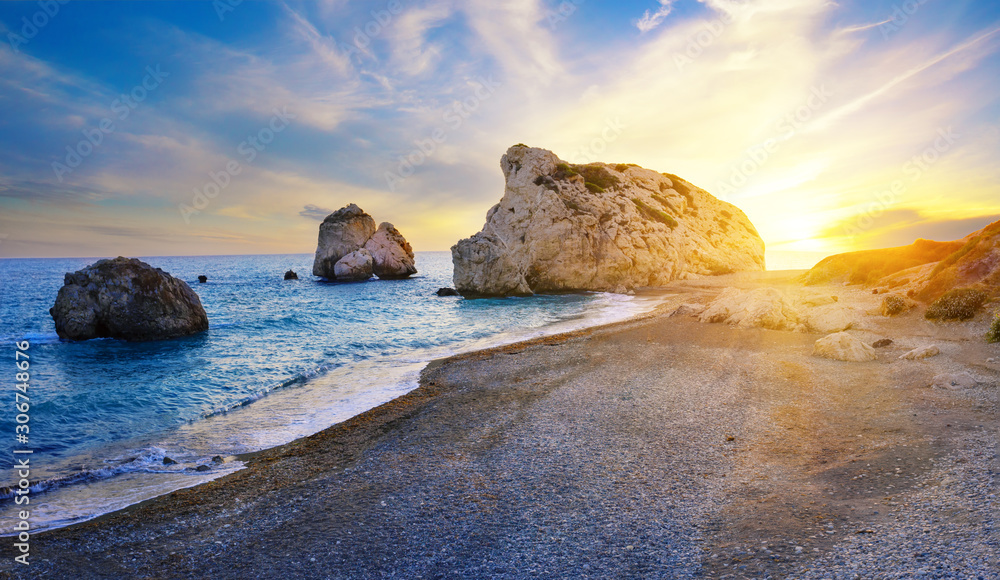 Aphrodites beach and stone at sunset in bright sunshine