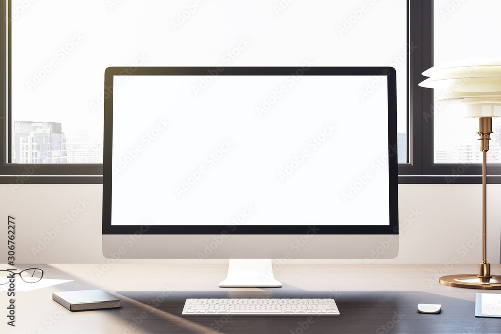 Desktop with empty white computer screen