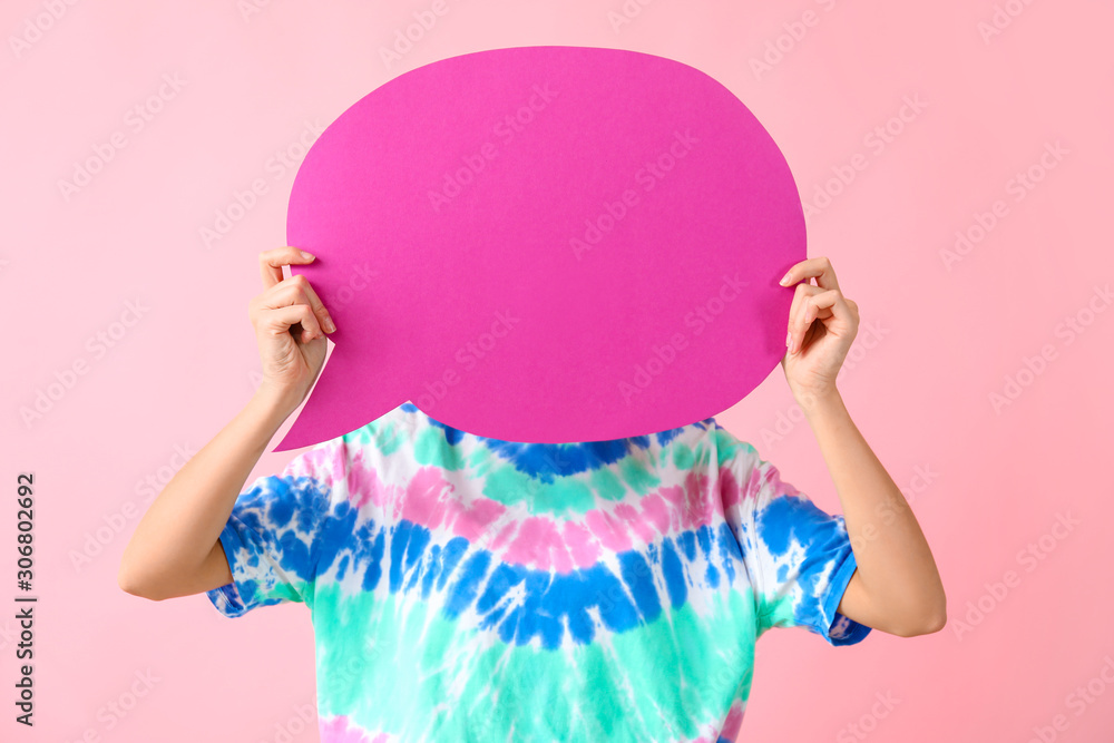 Beautiful young woman with blank speech bubble on color background