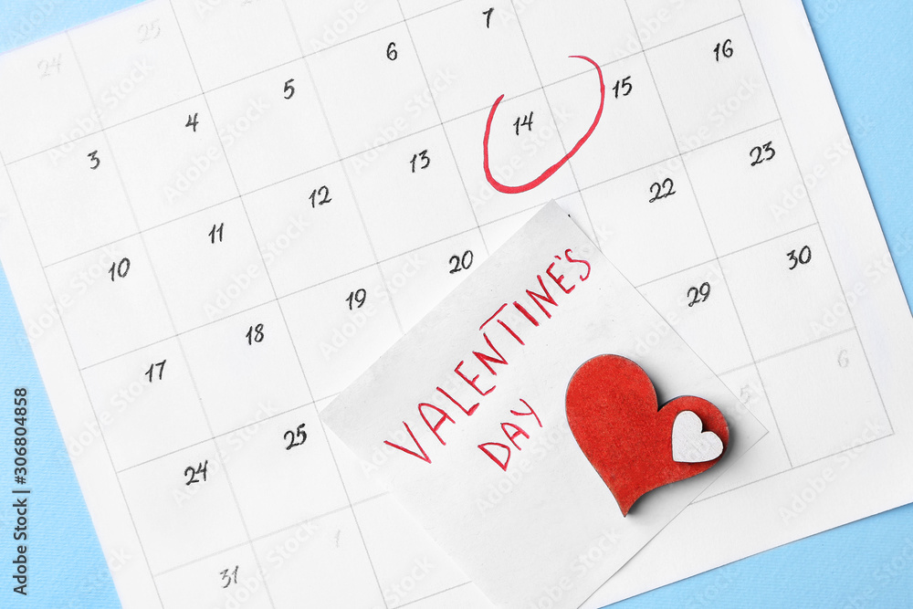 Calendar with marked date of Valentines Day on color background