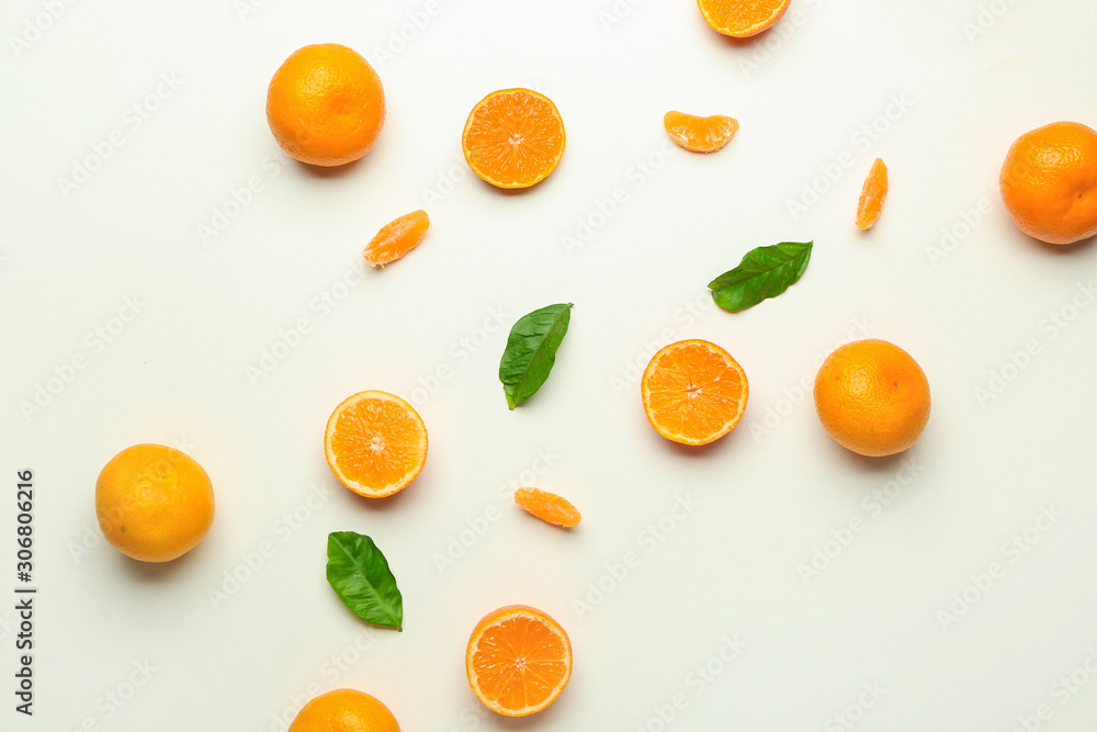 Ripe tasty tangerines on white background