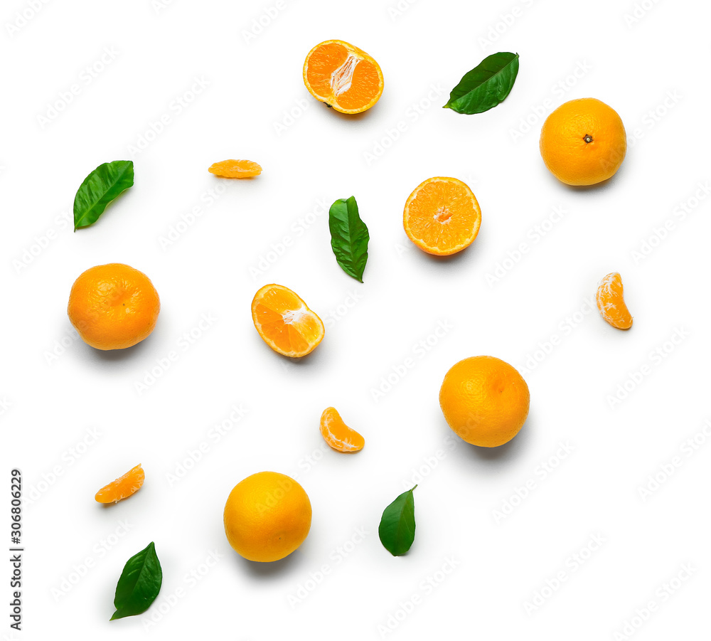 Ripe tasty tangerines on white background