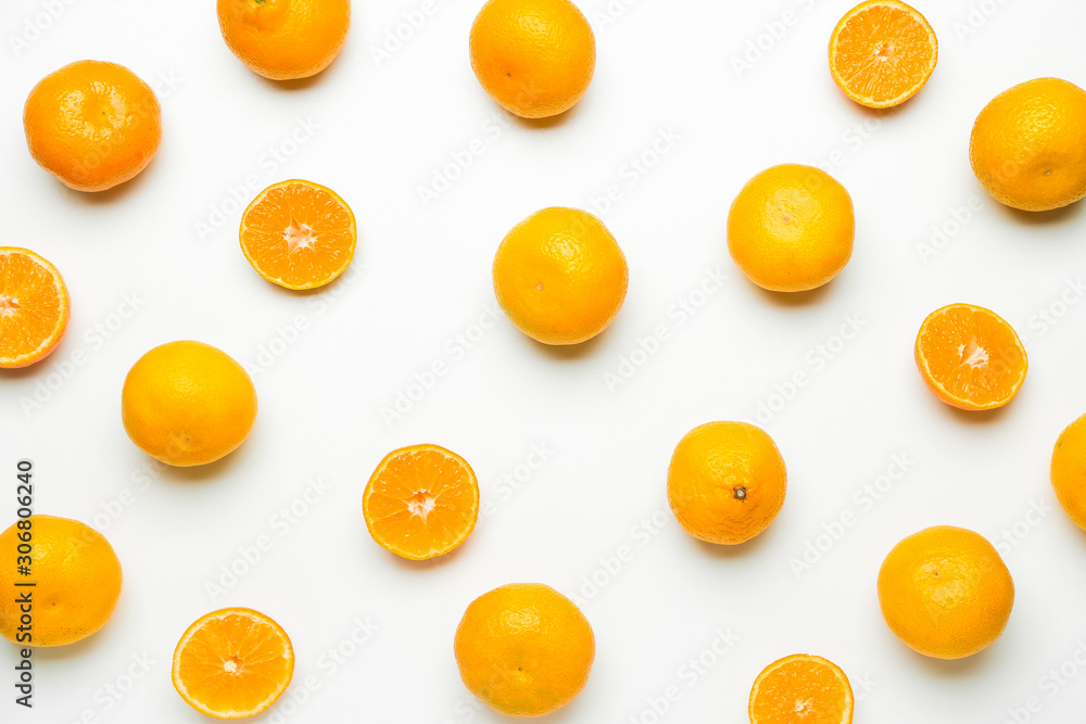 Ripe tasty tangerines on white background