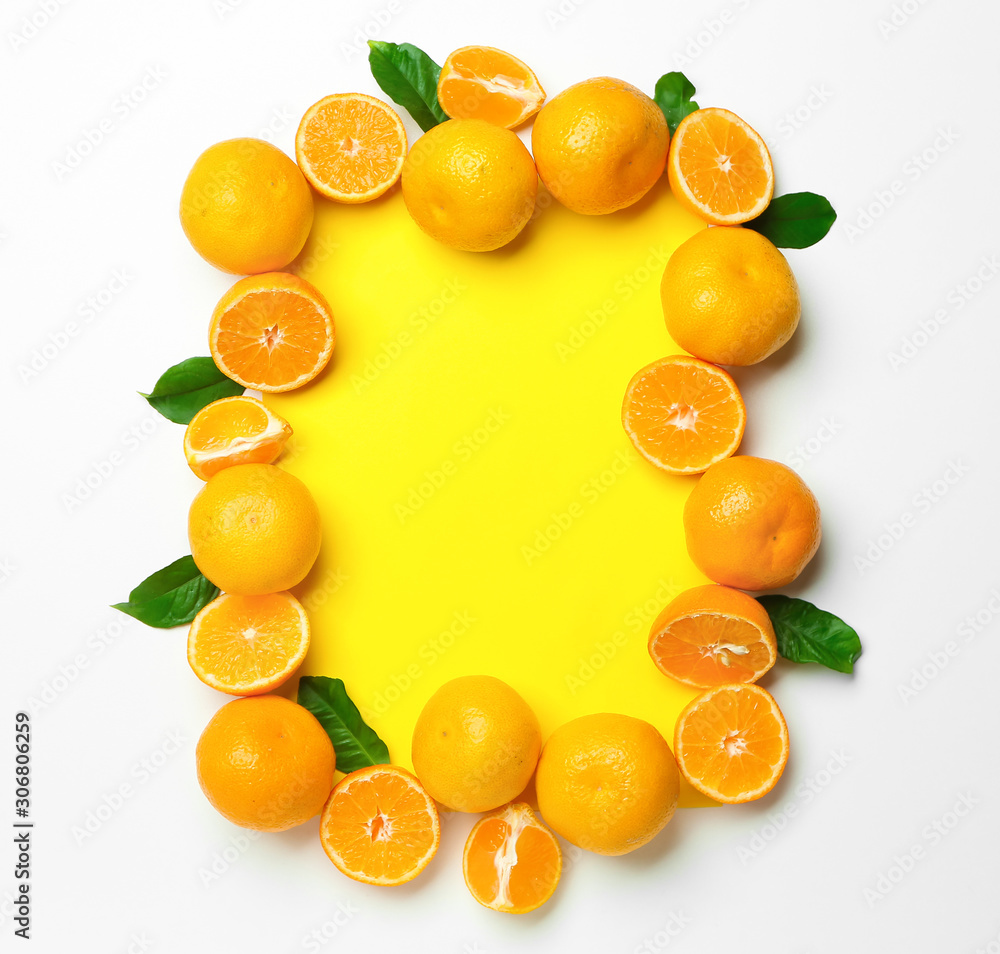 Frame made of ripe tasty tangerines on white background